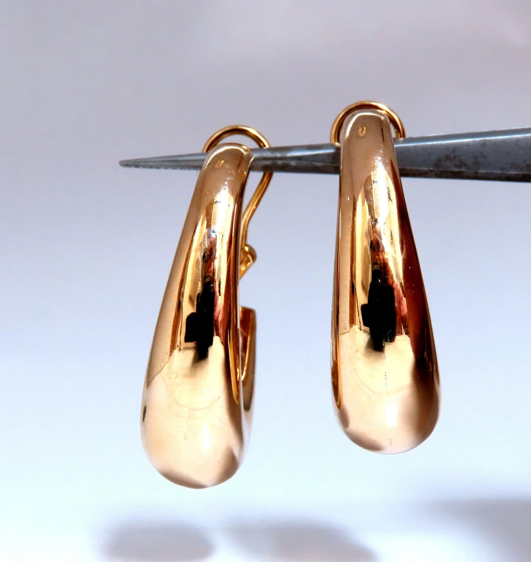 14Kt Gold Elongated Hoop Earrings Omega Clip**: Title: 14Kt Gold Elongated Hoop Earrings Omega Clip** Description: Elongated Tubular Gold Hoop Earrings Measurements of Earrings: 21mm diameter. 33mm long 10mm wide. 15.8 grams / 14kt. yellow gold Res