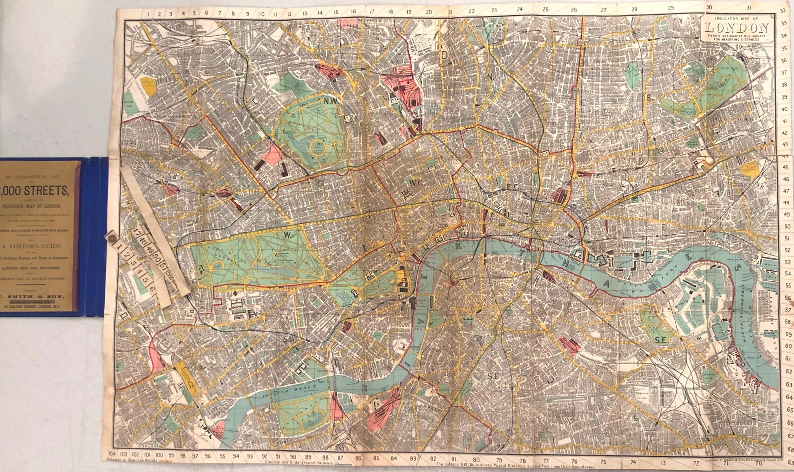 1890 Smith Tape Indicator Map of London: Title:1890 Smith Tape Indicator Map of London,li>Cartographer:Smith & Co Year/Place:1890 London Map Dimension (in.):19.5 X 28.8 in. Description:This is a folding map of London, with a tape measure inc