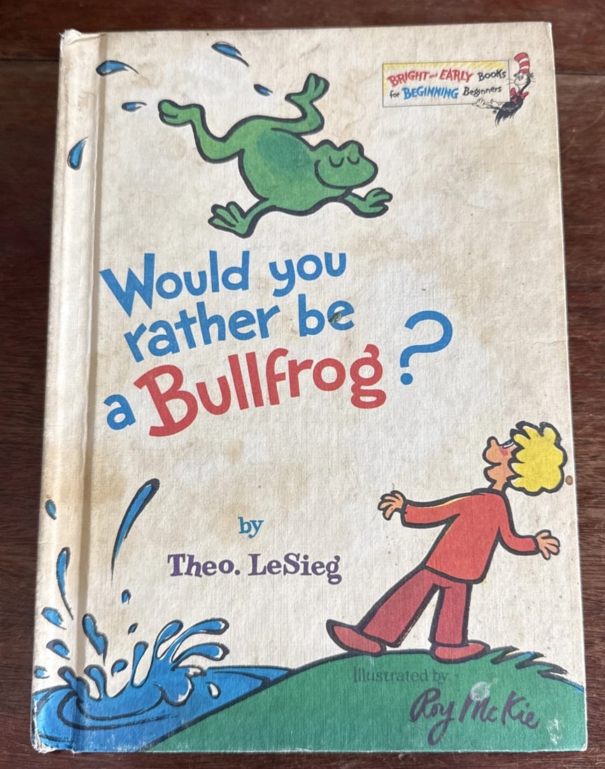 Would You Rather Be a Bullfrog? Hardcover Book by Theo LeSieg (Dr.Seuss) 1975 BC: The product is a vintage hardcover book titled "Would You Rather Be a Bullfrog?" by Theo LeSieg, published in 1975 by Random House Children's Books. This book, part of the Bright And Early Beginner Bo