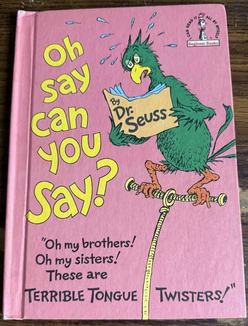 Oh Say Can You Say? Dr. Seuss HC Random HouseBC Edition Very Good Condition 1979: The product is a vintage hardcover book club edition of the book "Oh, Say Can You Say?" by Dr. Seuss, published by Random House Children's Books in 1979. This illustrated picture book is part of the B