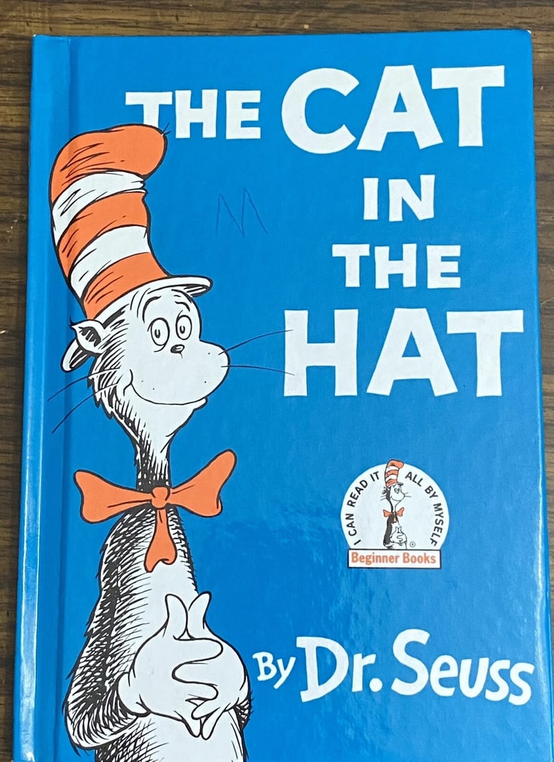 THE CAT IN THE HAT By Dr. Seuss Beginner Books Book Club Edition 1957/1985: THE CAT IN THE HAT by Dr. Seuss Reprint of 1957 Edition, Printed in 1985 Random House/Grolier Book Club Edition Child's name on front free end paper, letter "M" in ink on front cover. Else clean, bind