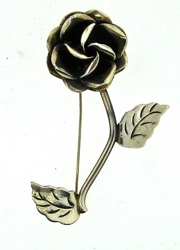 CUTE Sterling Silver Flower Brooch!: Title: CUTE Sterling Silver Flower Brooch! Description: DK Sterling Silver Flower Brooch! This wonderful brooch is one of a kind! The weight is 7.8 grams. The height is 2 ¼ inches. The length is 