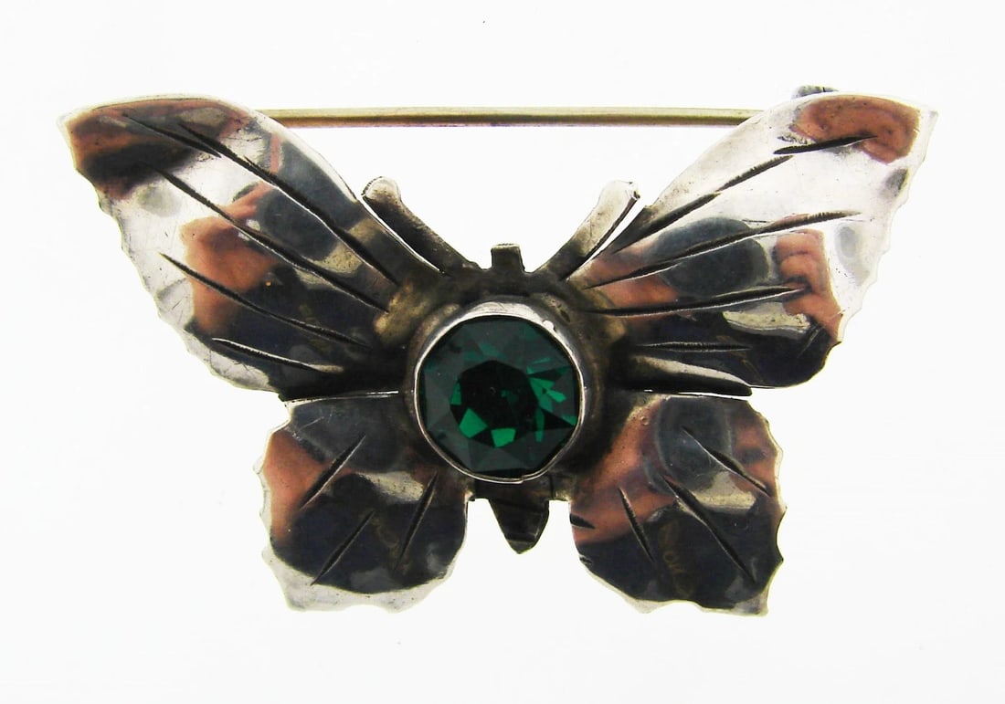 WHIMSICAL Hobe Sterling Silver & Green Stone Butterfly Brooch!: Title: WHIMSICAL Hobe Sterling Silver & Green Stone Butterfly Brooch! Description: DK Hobe Sterling Silver & Green Stone Butterfly Pin! This wonderful item is one of a kind! The weight is 5.1 grams.