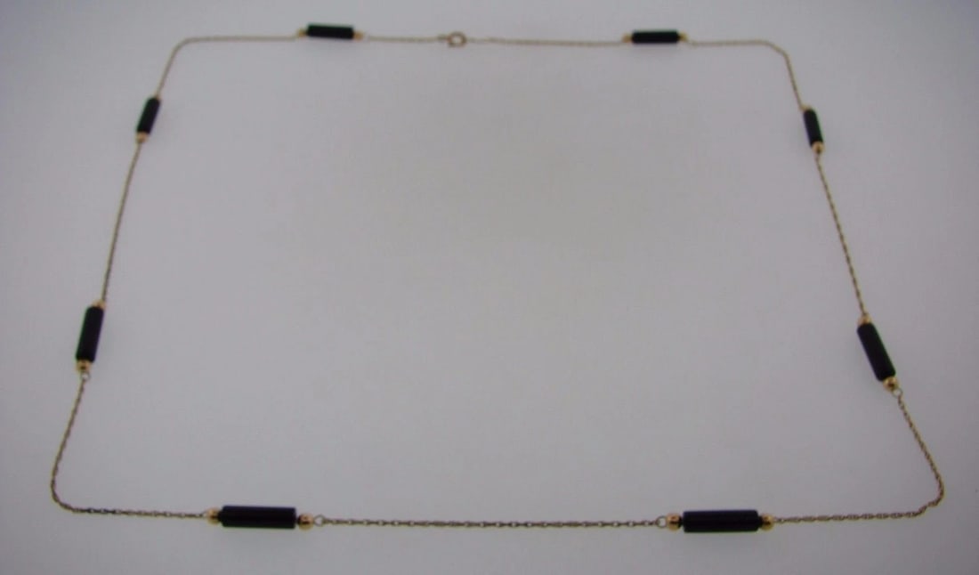onyx necklace: Title: onyx necklace Description: DK 14k Yellow Gold & Onyx Necklace · Wonderful necklace that is a necessity in your collection. · The weight is 5.6 grams. · The length is 25 inches.