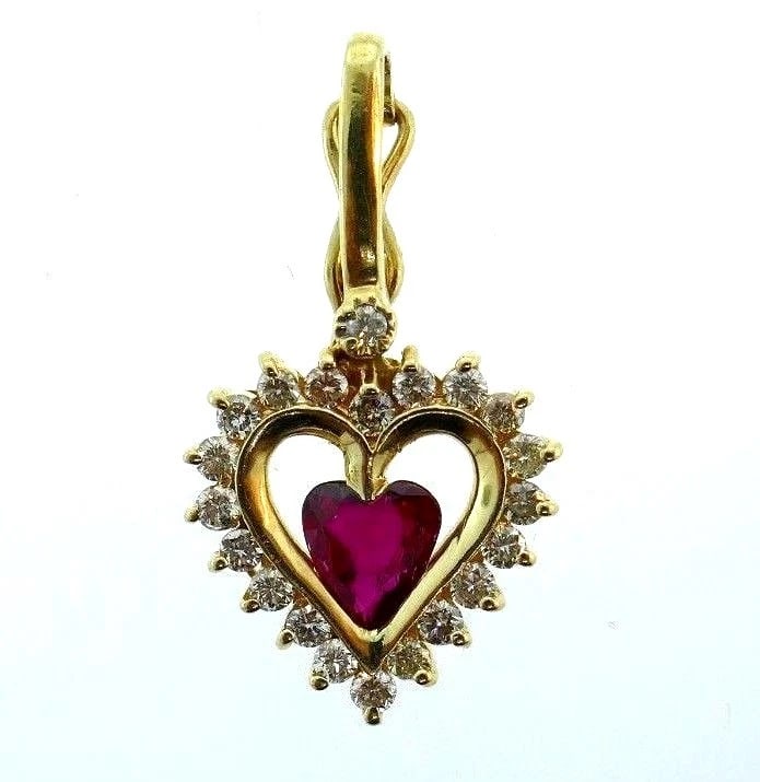 14k Yellow Gold Diamond Ruby Heart Charm Pendant: Title: 14k Yellow Gold Diamond Ruby Heart Charm Pendant Description: NS IT0 Cute 14k yellow gold diamond ruby heart charm pendant A clasp has a safety Stamped with a maker's mark Measurements: 1/8" H 