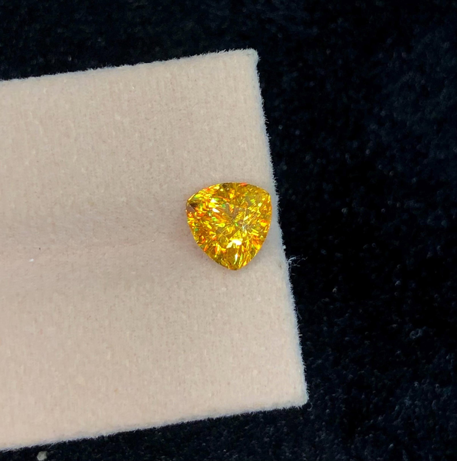 Trillion Cut Sphene Titanite Gemstone: Yellow Orange Sparkle, 2.245 Ct: Highlights Supplies for making crafts Materials: Gemstone: Sphene Carat weight: 2.245 This stunning full fire sphene titanite loose gemstone features a captivating Trillion cut that enhances its
