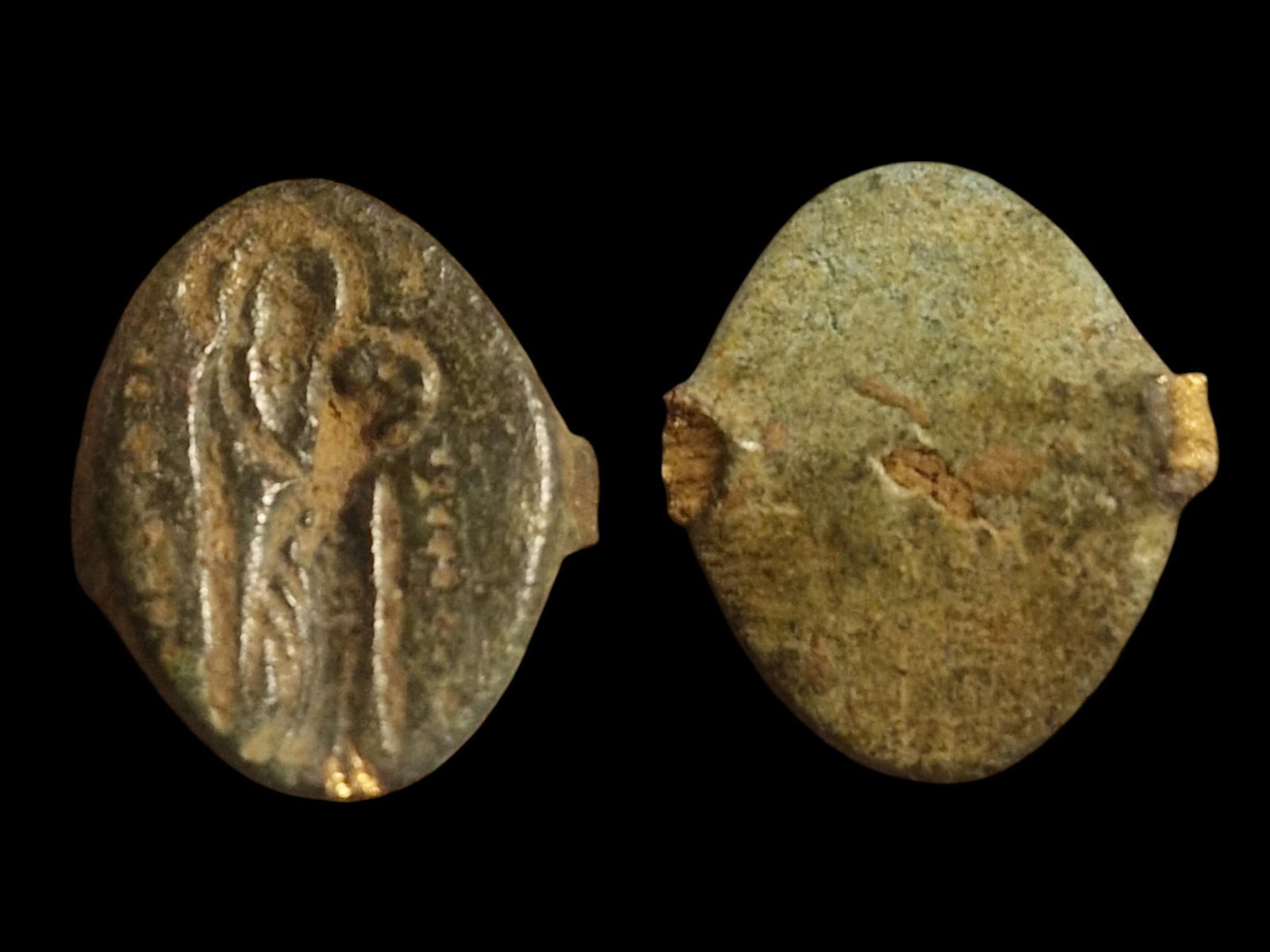 Medieval Bronze Ring Bezel – Virgin Mary & Christ Child c. 12th–14th Century: Title: Medieval Bronze Ring Bezel – Virgin Mary & Christ Child c. 12th–14th Century (Byzantine/Crusader Period) Description: A cast bronze ring bezel depicting a standing figure of the