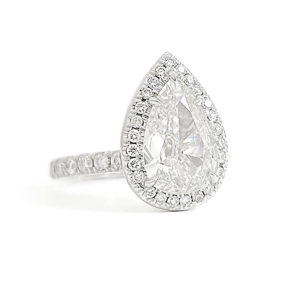 GIA Pear Diamond Halo Engagement Ring 14K White Gold, 2.32 CTW: GIA Pear Diamond Halo Engagement Ring 14K White Gold, 2.32 CTW This is a beautiful diamond engagement ring! Please let us know if you have any questions. Diamonds: 2.32 ctw; 1 pear shape 1.72 ct, F, V