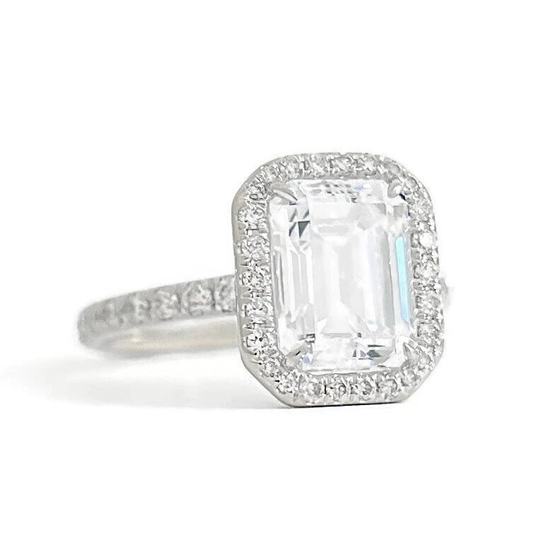 Emerald Cut CZ Diamond Halo Engagement Ring 14K White Gold, 2.78 Grams: Emerald Cut CZ Diamond Halo Engagement Ring 14K White Gold, 2.78 Grams Make a statement with this lovely ring! Please let us know if you have any questions. Gemstone: 1 emerald cut CZ cubic zirconia