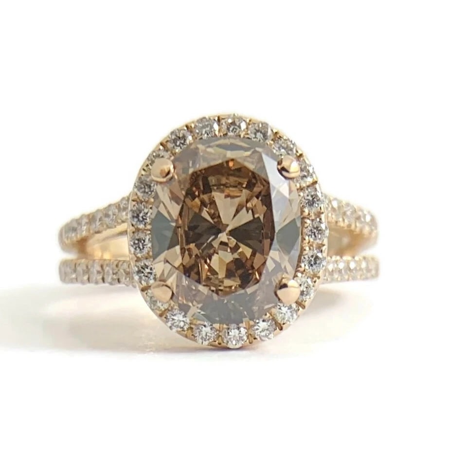 GIA Oval Brown Diamond Split Shank Halo Engagement Ring 14K Rose Gold 2.76 CTW: GIA Oval Brown Diamond Split Shank Halo Engagement Ring 14K Rose Gold 2.76 CTW This is a gorgeous diamond ring that could be worn as an engagement ring or statement ring! Please let us know if you hav