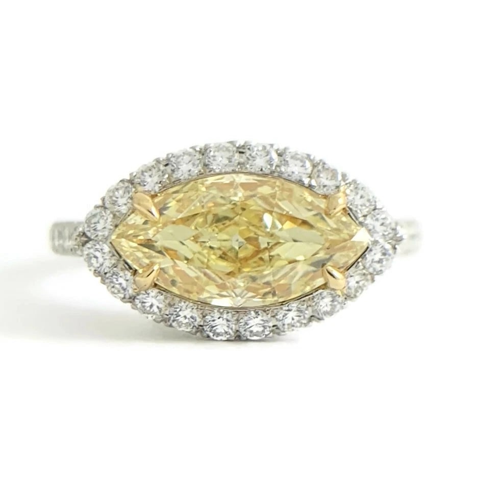 GIA Fancy Yellow Marquise Diamond Halo Engagement Ring Platinum 1.99 CTW: GIA Fancy Yellow Marquise Diamond Halo Engagement Ring Platinum 1.99 CTW This is a beautiful diamond engagement ring! Please let us know if you have any questions! Diamonds: 1.99 ctw; 1 marquise, 1.29