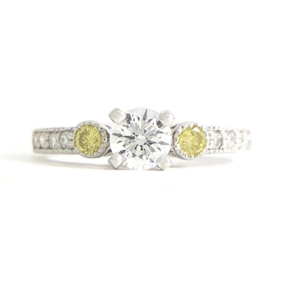 Round White and Yellow Diamond Engagement Ring 18K White Gold .75 CTW: Round White and Yellow Diamond Engagement Ring 18K White Gold .75 CTW This lovely diamond ring is sure to make her smile! Don't hesitate to ask any questions! Diamonds: .75 ctw; 1 round brilliant cut