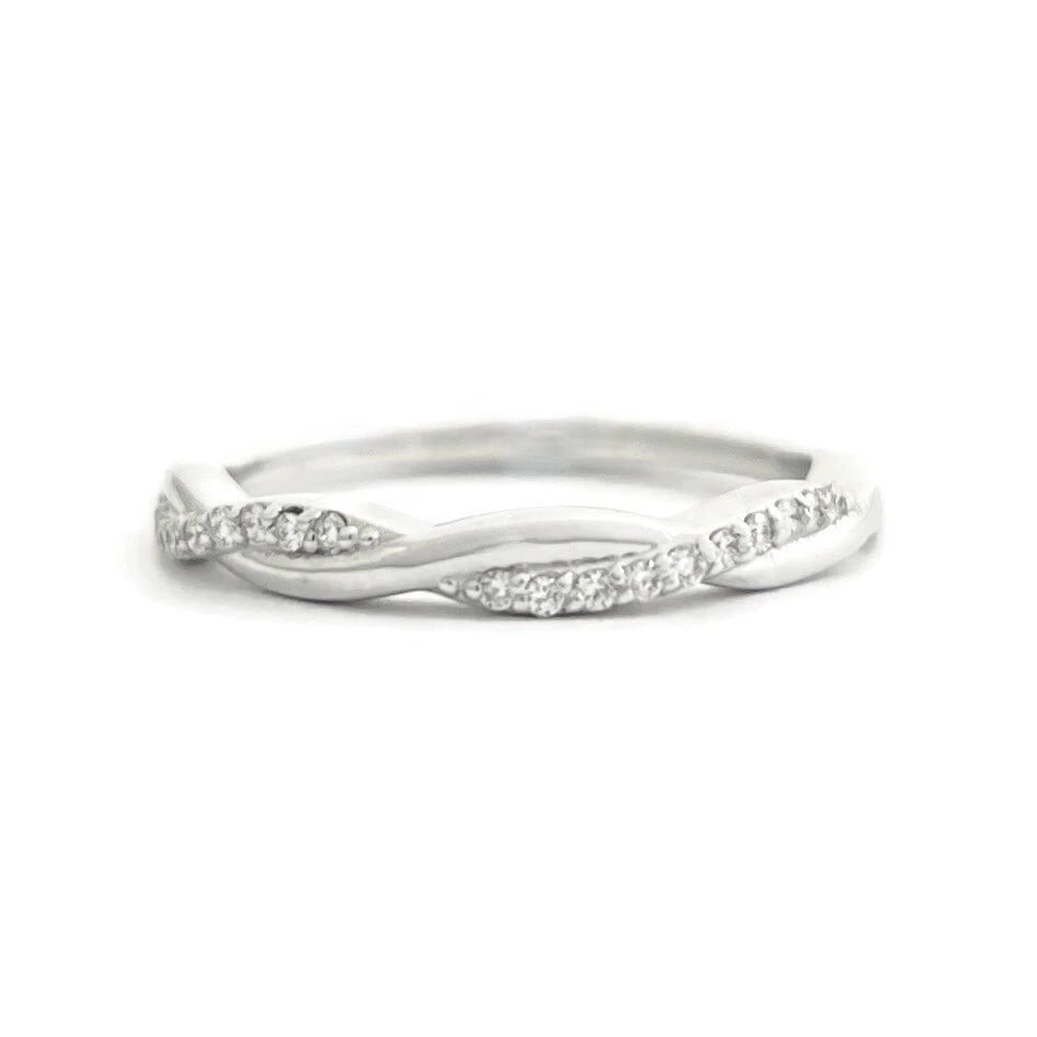 Diamond Infinity Twist Wedding Band Ring 14K White Gold .18 CTW, 2.49 Grams: Diamond Infinity Twist Wedding Band Ring 14K White Gold .18 CTW, 2.49 Grams This is a lovely ring that can be worn as a wedding band, anniversary ring or statement ring. Don't hesitate to ask any