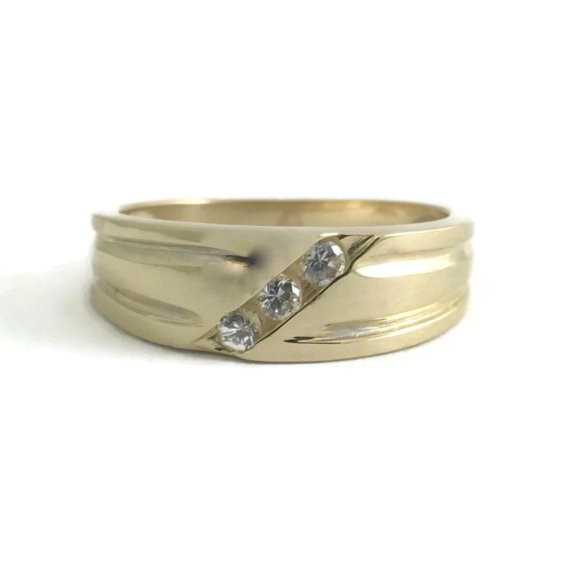 Men's 3-Stone CZ Cubic Zirconia Wedding Band Ring 14K Yellow Gold, 3.89 Grams: Men's 3-Stone CZ Cubic Zirconia Wedding Band Ring 14K Yellow Gold, 3.89 Grams This ring is a classic jewelry piece that can serve as a wedding band or special occasion ring. Let us know if you have an