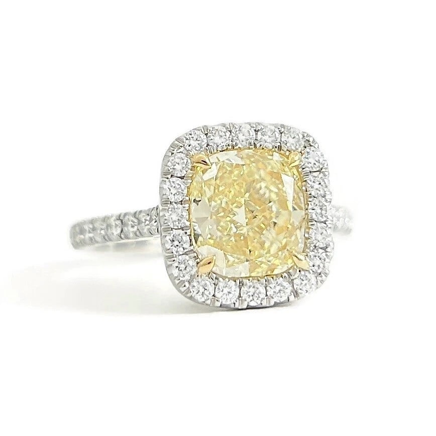 GIA Fancy Light Yellow Cushion Halo Diamond Engagement Ring Platinum, 2.67 CTW: GIA Fancy Light Yellow Cushion Halo Diamond Engagement Ring Platinum, 2.67 CTW This is a gorgeous diamond engagement ring! Please let us know if you have any questions! Diamonds: 2.04 ctw; 1 cushion 2