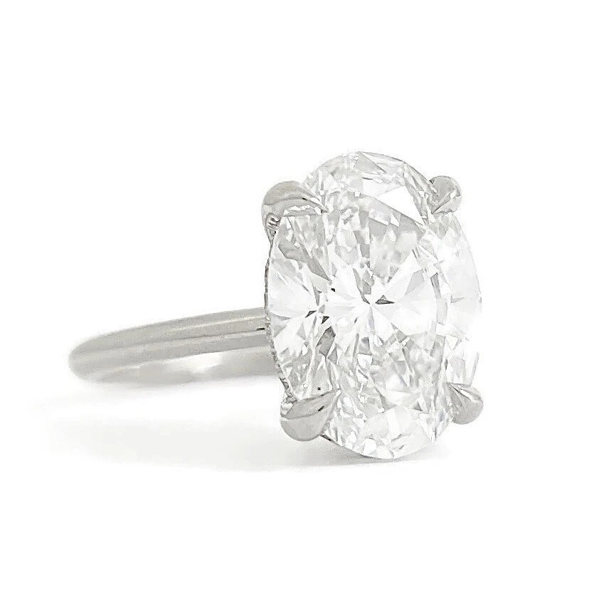 Oval Lab-Created Diamond Solitaire Engagement Ring 14K White Gold, 3.86 CTW: Oval Lab-Created Diamond Solitaire Engagement Ring 14K White Gold, 3.86 CTW This is a beautiful hidden halo diamond engagement ring! Please let us know if you have any questions. Diamonds: 3.86 ctw; 1