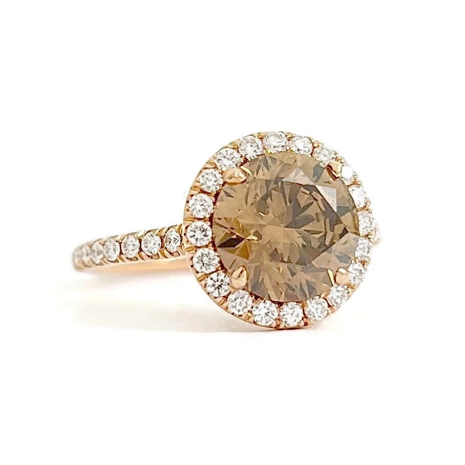 GIA Round Fancy Brown Diamond Halo Engagement Ring 14K Rose Gold 2.47 CTW: GIA Round Fancy Brown Diamond Halo Engagement Ring 14K Rose Gold 2.47 CTW This is a gorgeous diamond ring that could be worn as an engagement ring or statement ring! Please let us know if you have
