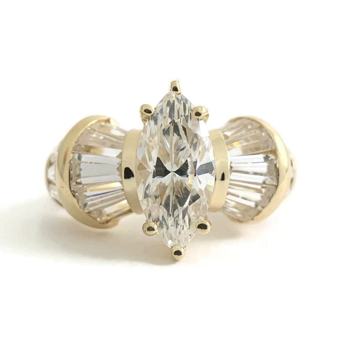 Marquise Baguette CZ Cubic Zirconia Engagement Ring 14K Yellow Gold, 5.47 Grams: Marquise Baguette CZ Cubic Zirconia Engagement Ring 14K Yellow Gold, 5.47 Grams This is a beautiful and unique ring! Please let us know if you have any questions. Gemstones: 2.62 ctw; 1 marquise cubic