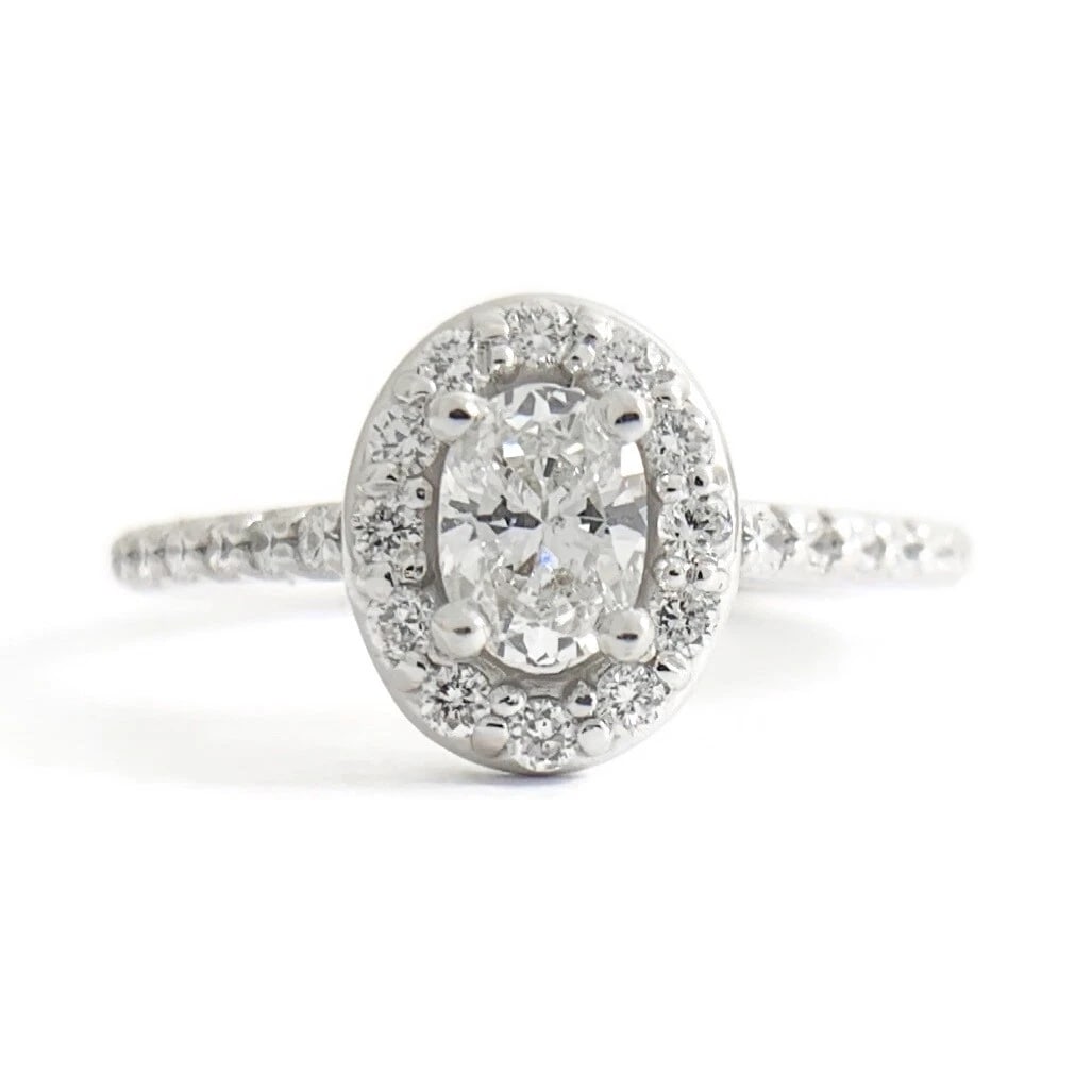 Oval Halo Thin Band Diamond Engagement Ring 14K White Gold .77 CTW: Oval Halo Thin Band Diamond Engagement Ring 14K White Gold .77 CTW This is a gorgeous diamond engagement ring! Please let us know if you have any questions! Diamonds: .77 ctw; 1 oval .40 ct, I, SI2; 2