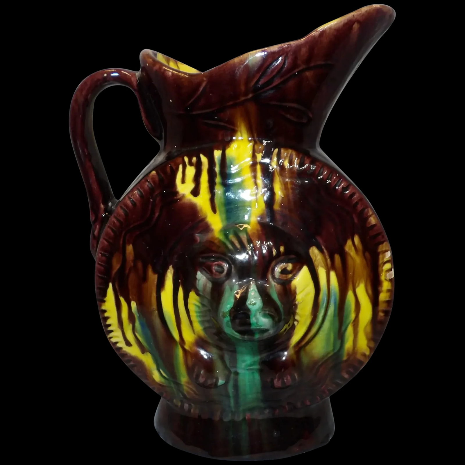 Antique Majolica Drip Ware Bear Pitcher: This Antique Majolica Drip Ware Bear Pitcher is in excellent condition. Had 3 minor glaze missing spots at the bottom (has been corrected) but no other problems such as cracks, crazing, or chips. It