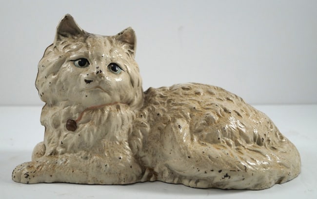 Reclining Cat Cast Iron Hubley Doorstop: Title: Reclining Cat Cast Iron Hubley Doorstop Additional Information: For all of the cat lovers out there, here is a delightful picturesque cast iron Reclining Cat Antique Doorstop. One of our favori