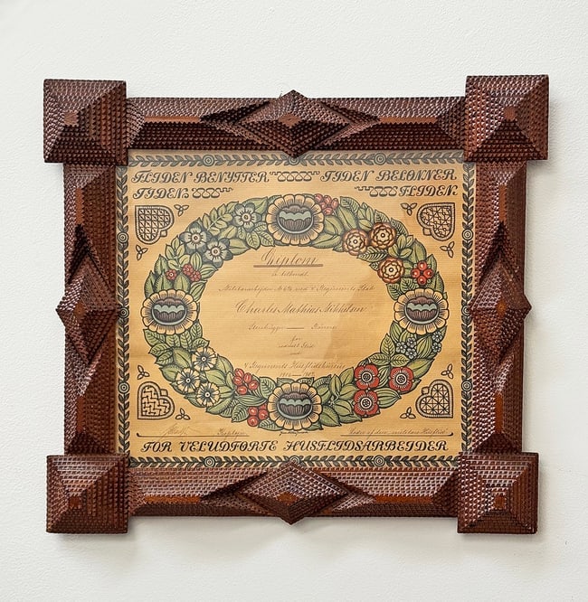 Tramp Art Frame Charles Mikkelsen: Tramp art frame made by Charles Mathias Mikkelsen housing a diploma dated 1907. Wonderful, all original frame without any issues. There is an historical image of him making a similar tramp art frame