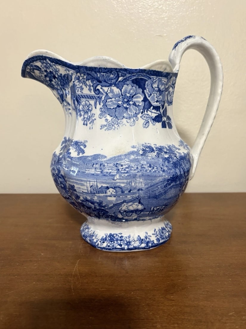 Clews Hudson River Newbury Historical Staffordshire Pitcher: It measures 9 3/8" high x 9 1/4" and dates around the 1830's. It is a clews hudson river scene. It has two chips restored on the top rim(see photos). Otherwise it has no other issues Shipping: