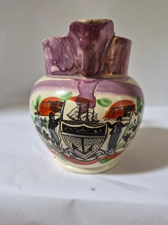 Lustre jug with nautical transfer: Pink lustre jug, polychromed, with a nautical transfer. "MARINER'S ARMS". 5 1-2". A rim chip on the back, I can get this restored for you. Excellent, fair restorer. England 1825. Shipping: Domestic: