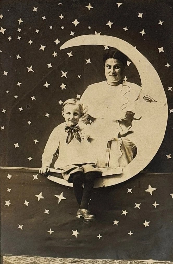 RPPC Real Photo Paper Moon Studio Postcard Woman & Child Stars Galore Circa 1900: Real photo paper moon postcard depicting a woman and a child. Lots of stars dominate the background. Both are smiling - which is rare. Image is crisp and clear. Card is in very good to excellent
