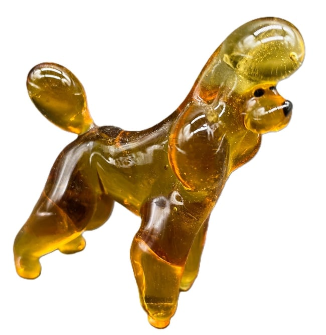Art Glass Amber Poodle Figurine: Date/Period: unknown Dimension: Approx. 2.25" tall x 2" Material: glass Additional Information: Art Glass Amber Poodle Figurine Shipping: Domestic: Flat-rate of $8.00 to anywhere within the contiguous
