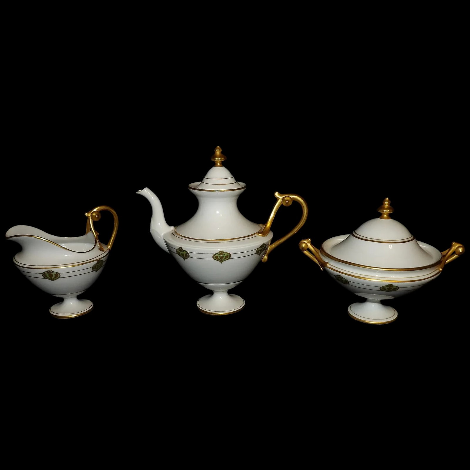 RARE Haviland France White with Gold Accent and Green Christmas Ornament Tea Set: This RARE Haviland France White with Gold Accent and adorned with Green Christmas Ornament Design Tea Set was not found on any search engine I looked for it on. It also was not found on Google Lens. T