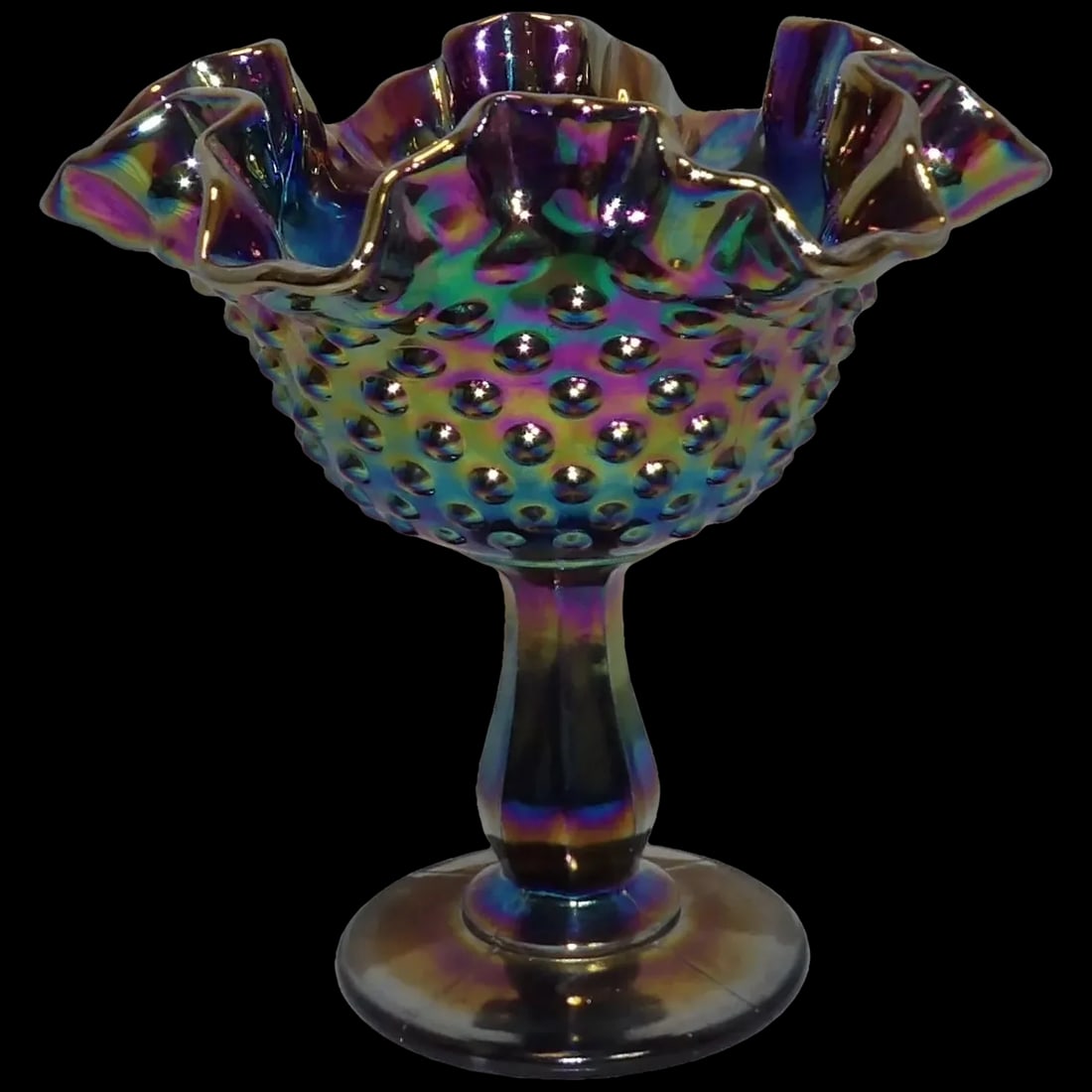 Fenton Amethyst Carnival Glass Hobnail Small Compote: This Fenton Amethyst Carnival Glass Hobnail Small Compote was produced in the 1970's and is in excellent condition. Appears to never have been used. It measures 6" tall and 6 1/8" in diameter. NO chip