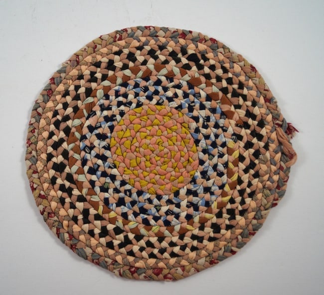 Antique Braided Table Mat County Americana #6: Title: Antique Braided Table Mat County Americana #6 Additional Information: An intricate Antique Braided Table Mat. Round in shape and finely braided, in wonderful blended colors with vintage fabric.