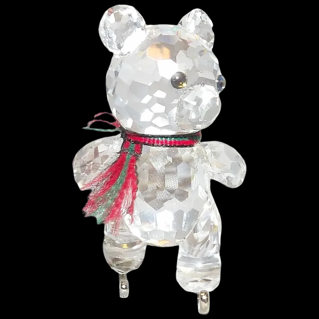 Swarovski Sliver Crystal Kris Bear on Skates #193011: The Swarovski silver crystal line was created by a Swarovski craftsman who was able to capture a silvery shine in the facets of the lead glass crystals. Swarovski Silver Crystals are made using a comb