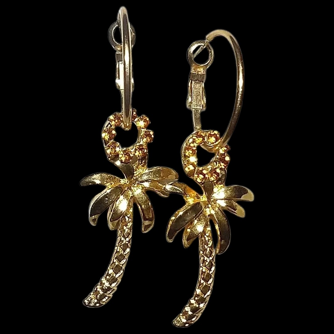 Palm Tree Gold Tone Palm Tree Post Earrings: This pair of Palm Tree Gold Tone Palm Tree Post Earrings are in excellent condition. Includes a ring of sparkling rhinestones and hoops that prevent loss of earring. Shipping: Domestic: Flat-rate of $