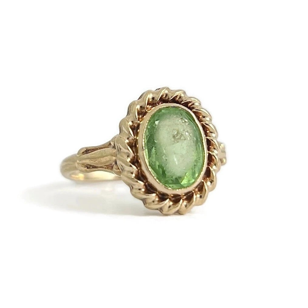 Vintage 1930's Oval Green Peridot Gemstone Ring 10K Yellow Gold, 1.68 Grams: Vintage 1930's Oval Green Peridot Gemstone Ring 10K Yellow Gold, 1.68 Grams This is such a lovely and unique ring! Please let us know if you have any questions. Circa: 1930's Gemstones: one oval green