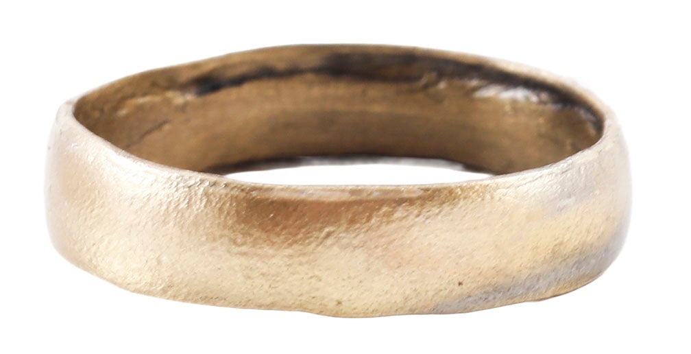 VIKING WOMAN’S WEDDING RING 9TH CENTURY, SIZE 7 3/4: 9th century, Cambridgeshire England. Bronze, with low rounded face 4.5mm width. Surface textured from burial. Professionally refurbished with the 24karat gold surface restored. Jewelry gift boxed