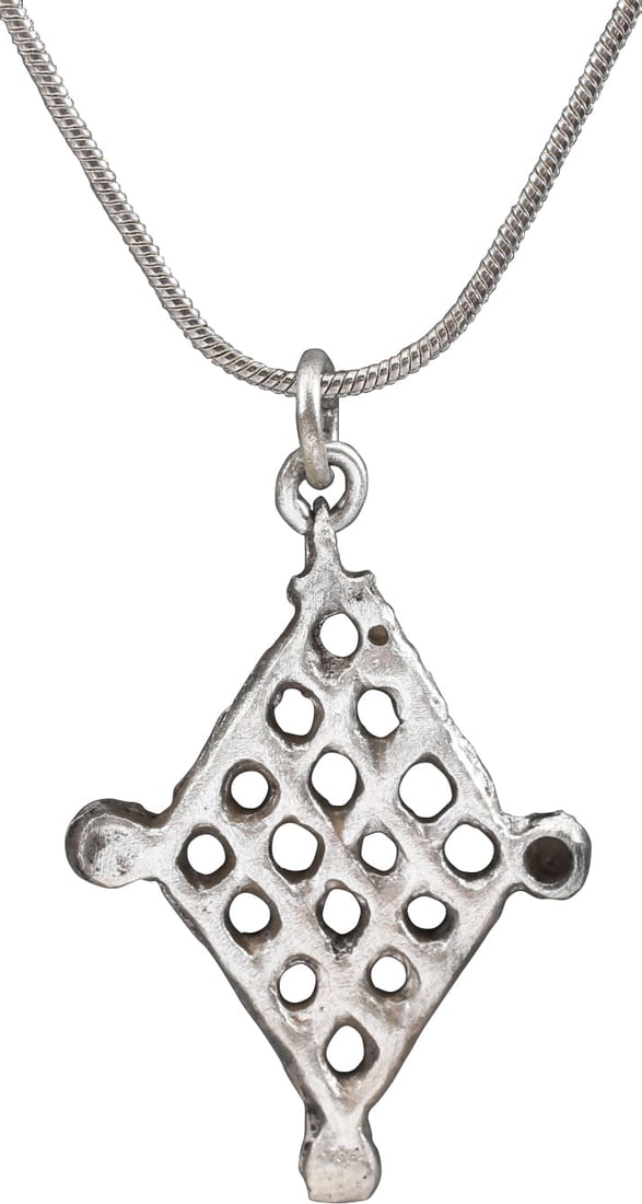 RARE VIKING LATTICE " FERTILE FIELDS" AMULET C.850-1050 AD: Diamond form with loops at the corners and 4 x 4 lattice piercing. Just under 1 ¼" (1.23" �) total height. Known to represent " sown fields" or " fertile fields" and perhaps worn for