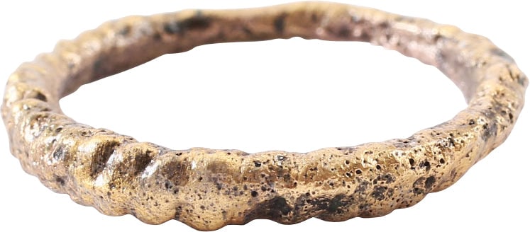 VIKING ROPED OR TWIST WEDDING RING, SIZE 9: Cambridgeshire, England, 866-1067 AD. Oval form, size 9. 1.8mm at the bottom swelling to 3.4mm at the top. Modeled roped motif producing a crest. The spiral or helix was a favorite Viking form. Profes