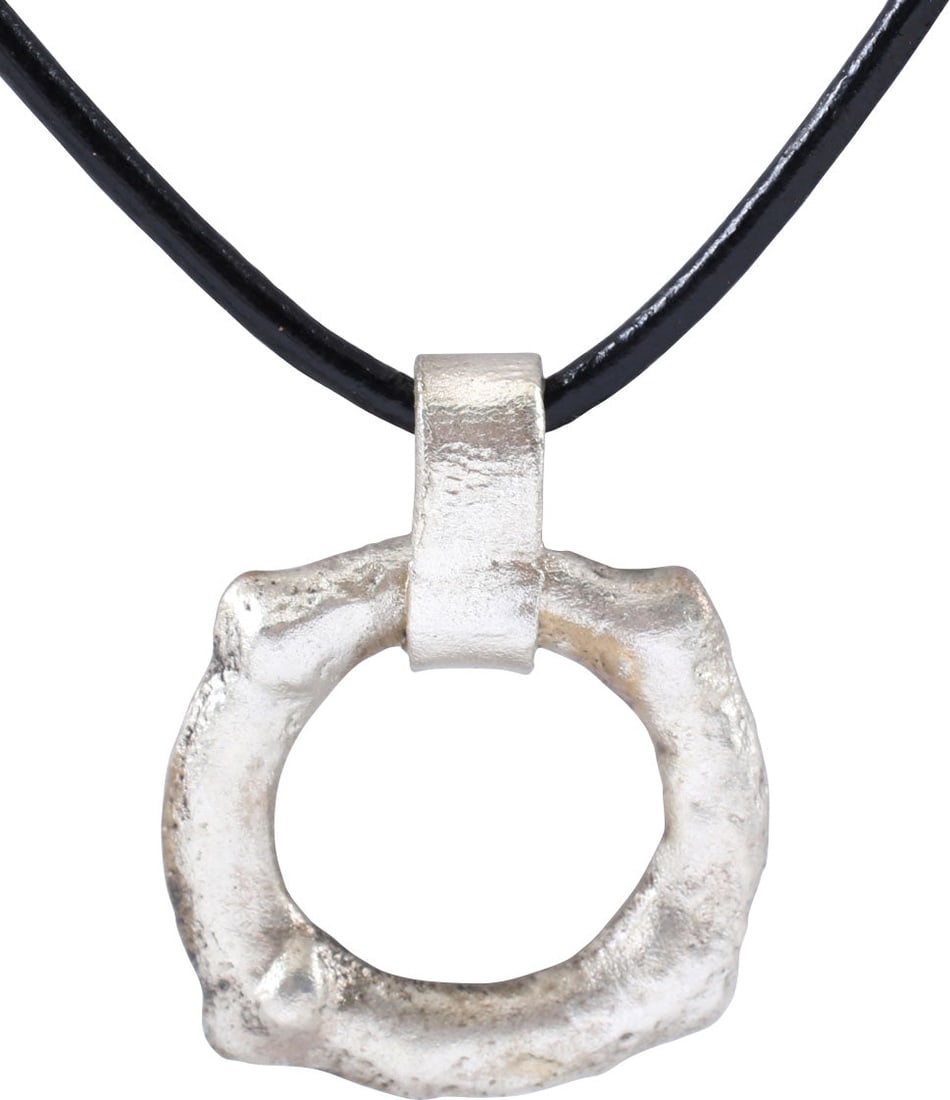 CELTIC PROSPERITY RING NECKLACE, C.300 - 100 BC: Before the Roman invasion of the British Isles, rings of bronze, silver, and gold were used as a means of exchange, particularly in Ireland. Most exchanges of goods and property were conducted by bart