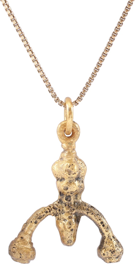 VIKING LUNAR PENDANT NECKLACE C.900-1000 AD.: Gilt bronze. As expert navigators, the constellations signified mystery and power to Vikings. Lunar pendants were worn as pectorals as well as suspended from belts, other clothing and horse harnesses.