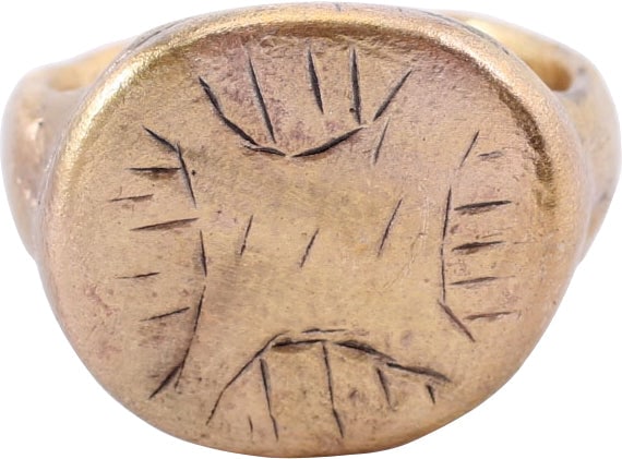 FINE MEDIEVAL RING C.9TH-12TH CENTURY AD SIZE 5 ½: The Viking period through early Crusades. Gilt bronze, of heavy proportions, size 5 1/2. Rounded face 4.1mm width band with slightly thickened bottom in the Roman taste and as carried on through the