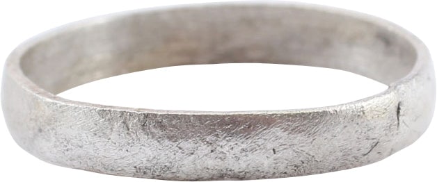 VIKING WOMAN'S WEDDING RING, 850-1050 AD,: Silvered bronze, size 4 1/4 for wear between the first two joints of the small finger as was the custom. 2.6mm rounded faced band. Crisp with light surface texture from burial. Professionally