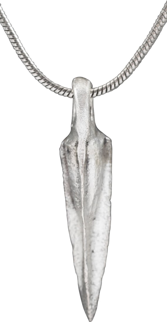 ROMAN ARROWHEAD PENDANT NECKLACE, C.100 BC: Bronze with slightly tapered socket with three veins transitioning to pyramidal tip. One side with adhesive release hole as typical, for seating on the shaft. 0.86” (just under 7/8”) lengt
