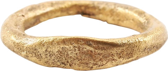 ANCIENT VIKING BEARD RING C.850-1050 AD: Gilt bronze. Circular with a flat to the front. Circular section, just over ½" inside diameter. The use of beard rings by Vikings is well documented though very few genuine examples survive.