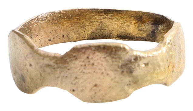 MEDIEVAL WOMAN’S RING, 10TH CENTURY AD, SIZE 9 1/4: Gilt bronze, size 9 1/4. 4.1mm rounded band flared to the shoulders. The top expanded with three ovals each with a saltire inscribed. See Ancient Rings, Pollio. Professionally refurbished with the