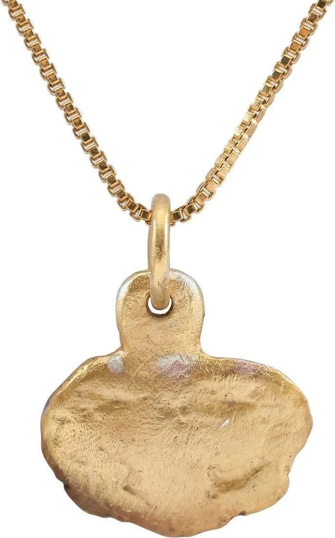VIKING HEART PENDANT NECKLACE C.1000 AD: A good example of a particularly intricate form. Broad heart in its naturalistic (uncusped) form. Slightly fluted at the bottom quarters. Broad edges curled to form the top of the trefoil in the field