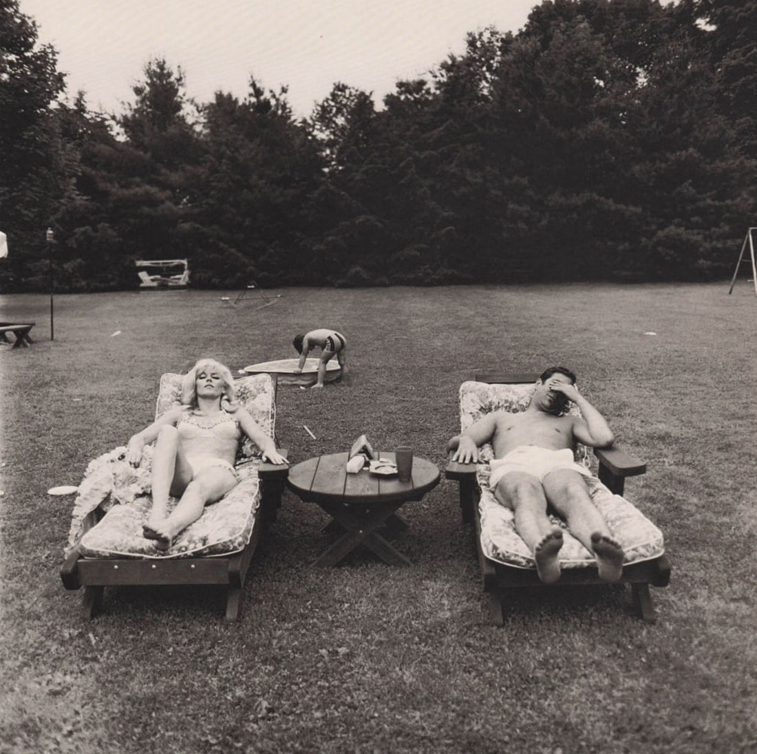 DIANE ARBUS - A Family on their lawn one Sunday in Westchester NY, 1968: Artist: DIANE ARBUS Print Title: A Family on their lawn one Sunday in Westchester NY, 1968 Medium: Duotone Print Printed 2000’s in Germany Image size (inches) approx. 8 x 8” Diane Arbus