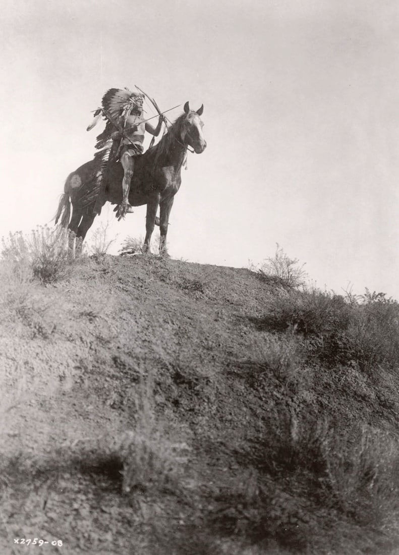 EDWARD CURTIS - Ready for the charge, Apsaroke: Artist: EDWARD CURTIS Print Title: Ready for the charge, Apsaroke Medium: Duotone Photo-lithograph Printed 1990s in Hong Kong Image Size:12 x 8.5” COA Included Reserve: $40.00 Shipping: