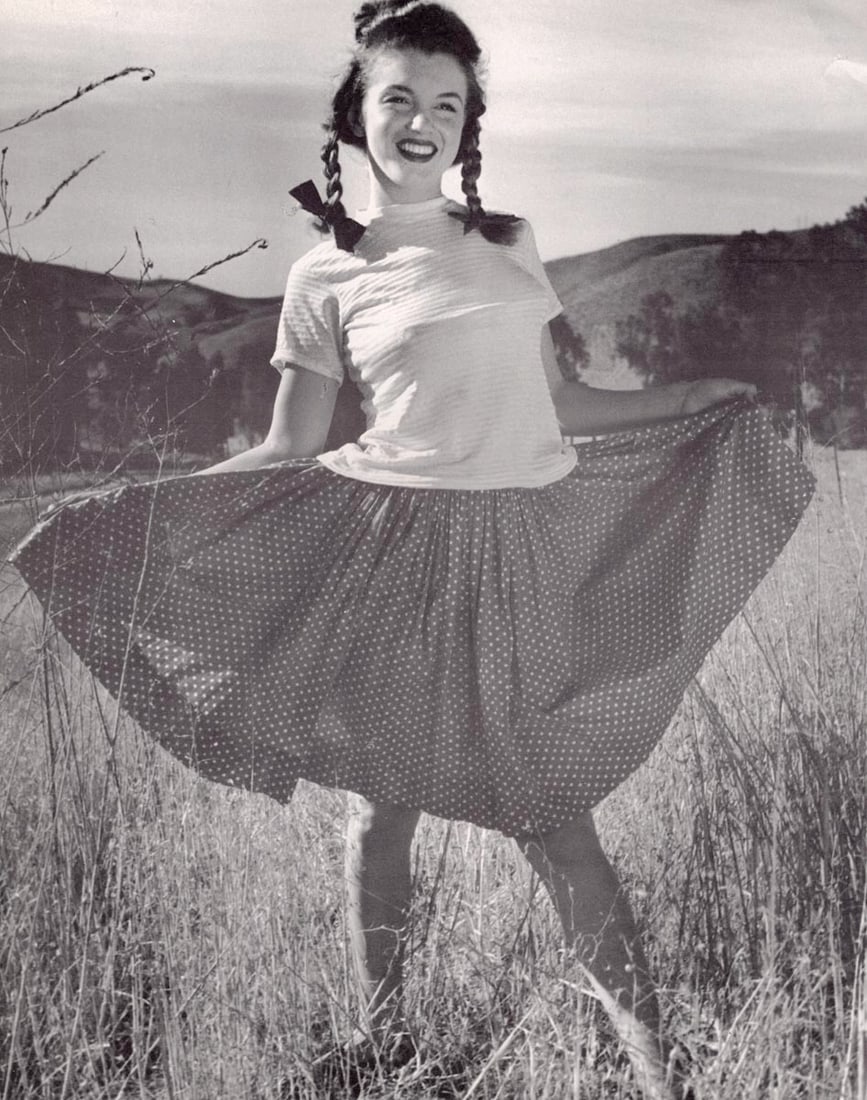 ANDRE DE DIENES - Marilyn Monroe (Norma Jean)(with cape): Artist: ANDRE DE DIENES Print Title: Marilyn Monroe (Norma Jean) Medium: Photo-lithograph Printed 1990’s in Singapore Image size (inches) approx. 12 x 9” Andre De Dienes De Dienes was a